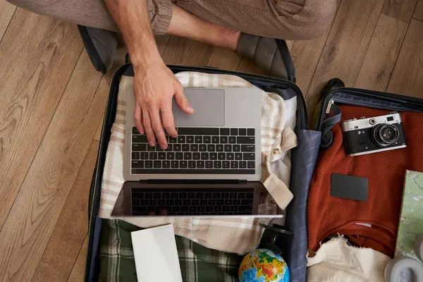 a laptop is put in a luggage